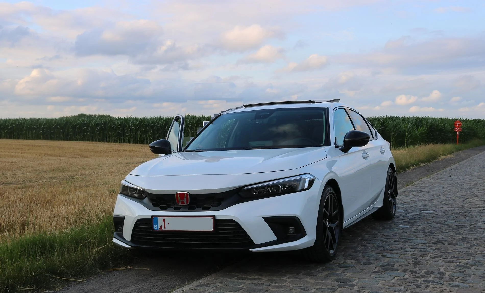 11th Gen Honda Civic Platinum White Pearl 2024 e:HEV Advance trim hatch - European hybrid made in Japan forum